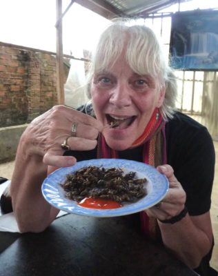Eating roasted crickets in Vietnam - tasty!