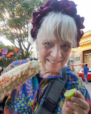 Roasted "elote" smothered with mayo, shredded cheese and spices in Oaxaca Mexico