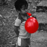 BelizeanBoyWithBalloon678x904 (SpotColor – a Purely Magical Photo App)