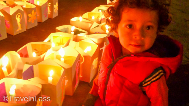 Young child gazes at the glowing lanterns