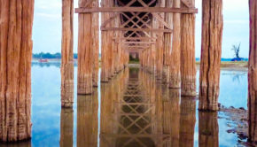 The famous 1.2 kilometer-long U Bein teak bridge in Amarapura, near Mandalay in Myanmar.