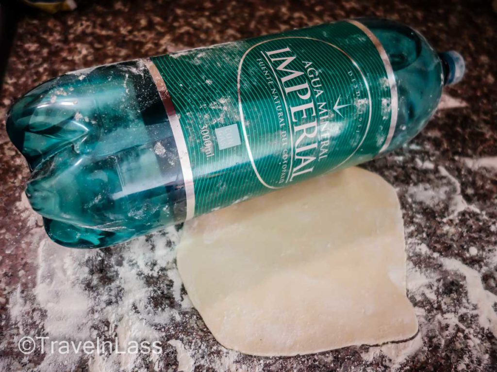 A full bottle of water (or wine) makes a fine rolling pin.