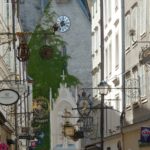 Charming “guild signs” hanging from every facade in Salzburg, Austria’s “Getreidegasse” square. (Skipping Through The Balkans: #2 Austria)