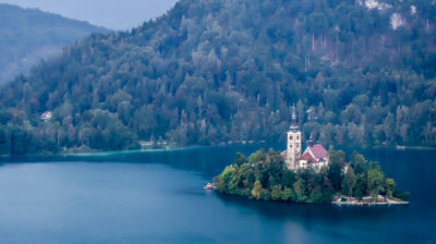 Out Lady of the Lake Church perched on the island amid Lake Bled, Slovenia. (Skipping Through the Balkans: #3 Slovenia – Lake Bled)