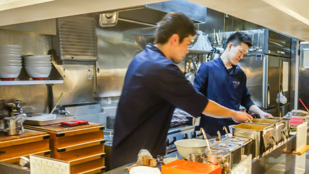 Just two chefs carefully serving the ramen goodness.