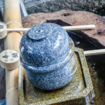 At most shrines and temples in Japan you’ll find a “temizuya”, a small fountain with bamboo ladles, or “shakushi”; all guests are expected to wash both hands and mouths to purify themselves before entering. (Japan Adventures: Kyoto (the Fab and the Meh))