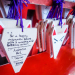You can buy a small “Ema” board (Japanese wishing plaque) and write a wish to leave behind at the Fushima Inari shrine. (Japan Adventures: Kyoto (the Fab and the Meh))