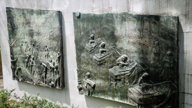 Relief sculptures beside the Memorial Tower for Mobilisation Students that perished in the blast.