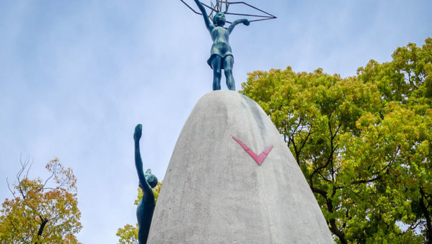 The Children's Peace Memorial: At the top of the monument is a statue of a young girl lifting a golden crane, the Japanese symbol of longevity and happiness.
