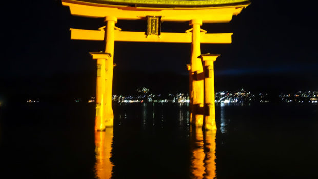 After dark reflections of the Itsukushima Torii Gate at Miyajima, Japan