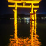The glorious Itsukushima Torii Gate shimmering in the darkness at Miyajima, Japan (Japan Adventures: Hiroshima and Miyajima)